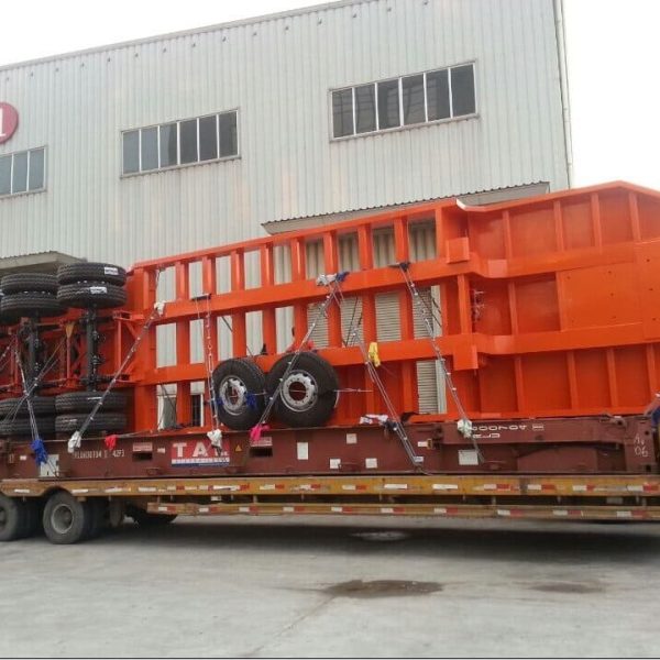 Over-width truck by flat rack